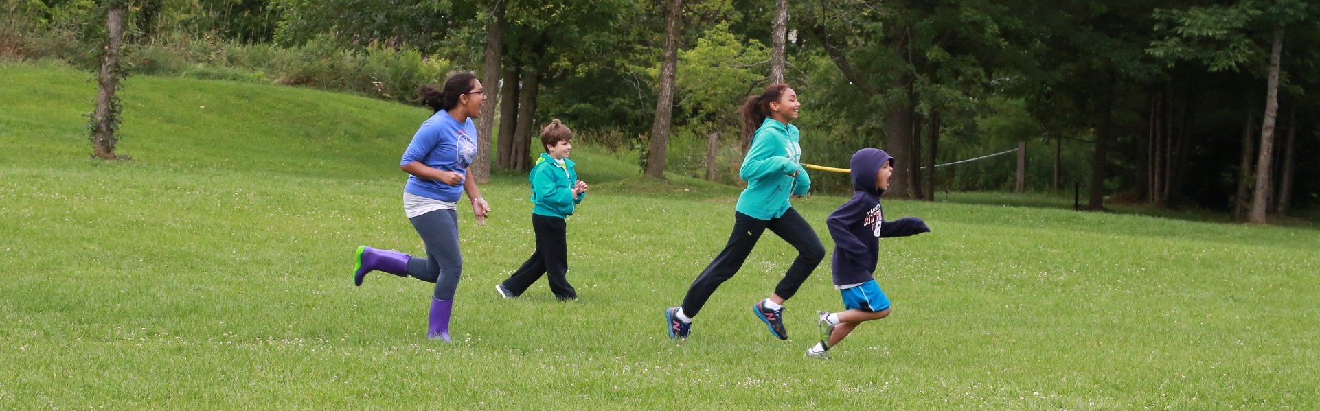 kids running in field at Kortright Centre