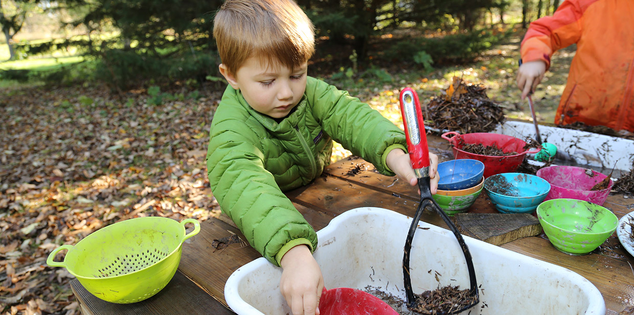 pre-school boy takes part in outdoor education program at Kortright Centre