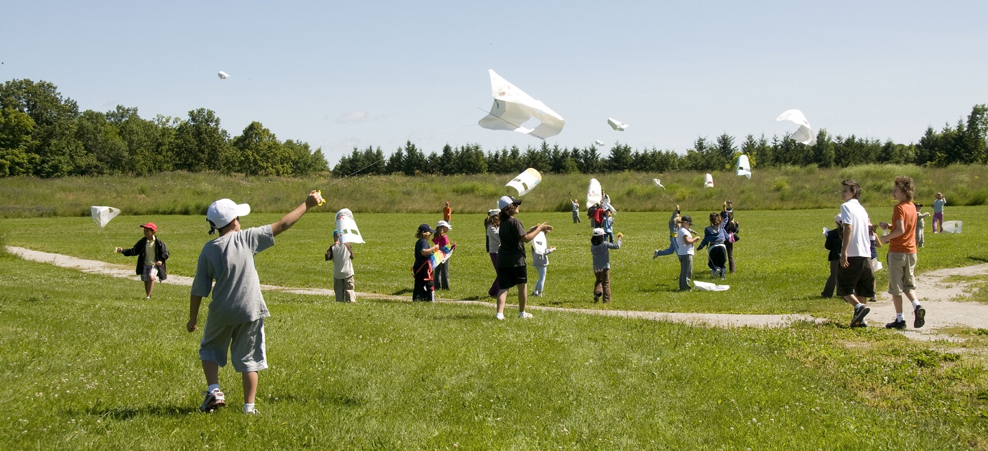 students fly kites at Kortright Centre