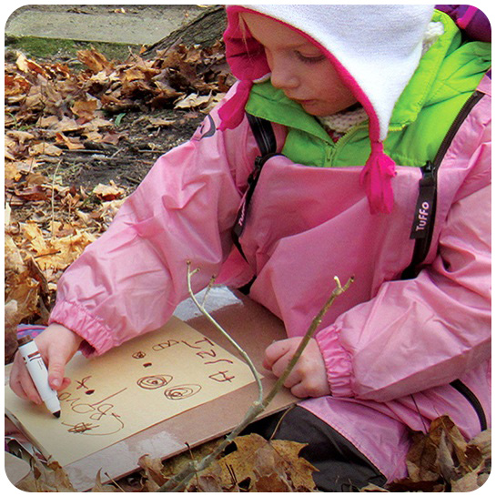 young girl drawing picture at Kortright Nature School