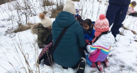 Educator talks to preschool students at The Nature School at Kortright Centre