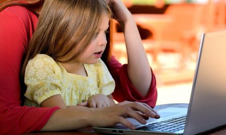 child uses laptop to participate in The Nature School virtual learning program