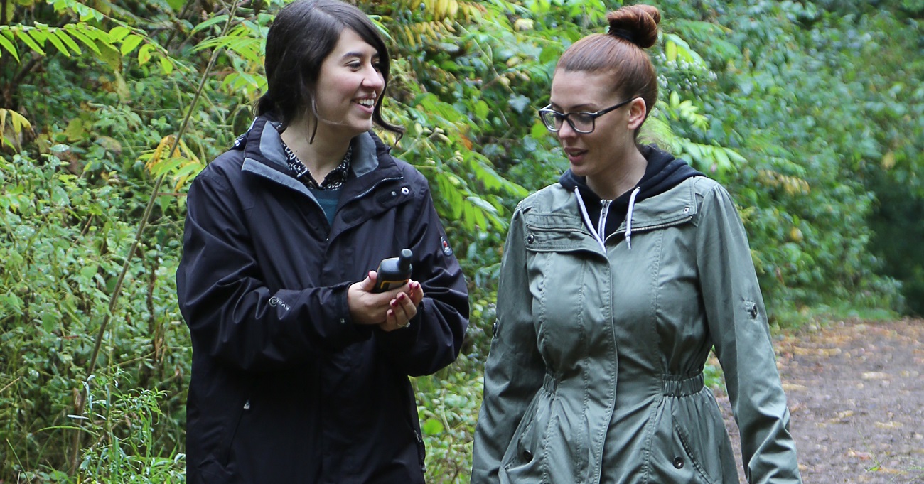 corporate team members learn to use GPS device as part of geocaching workshop at Kortright Centre for Conservation