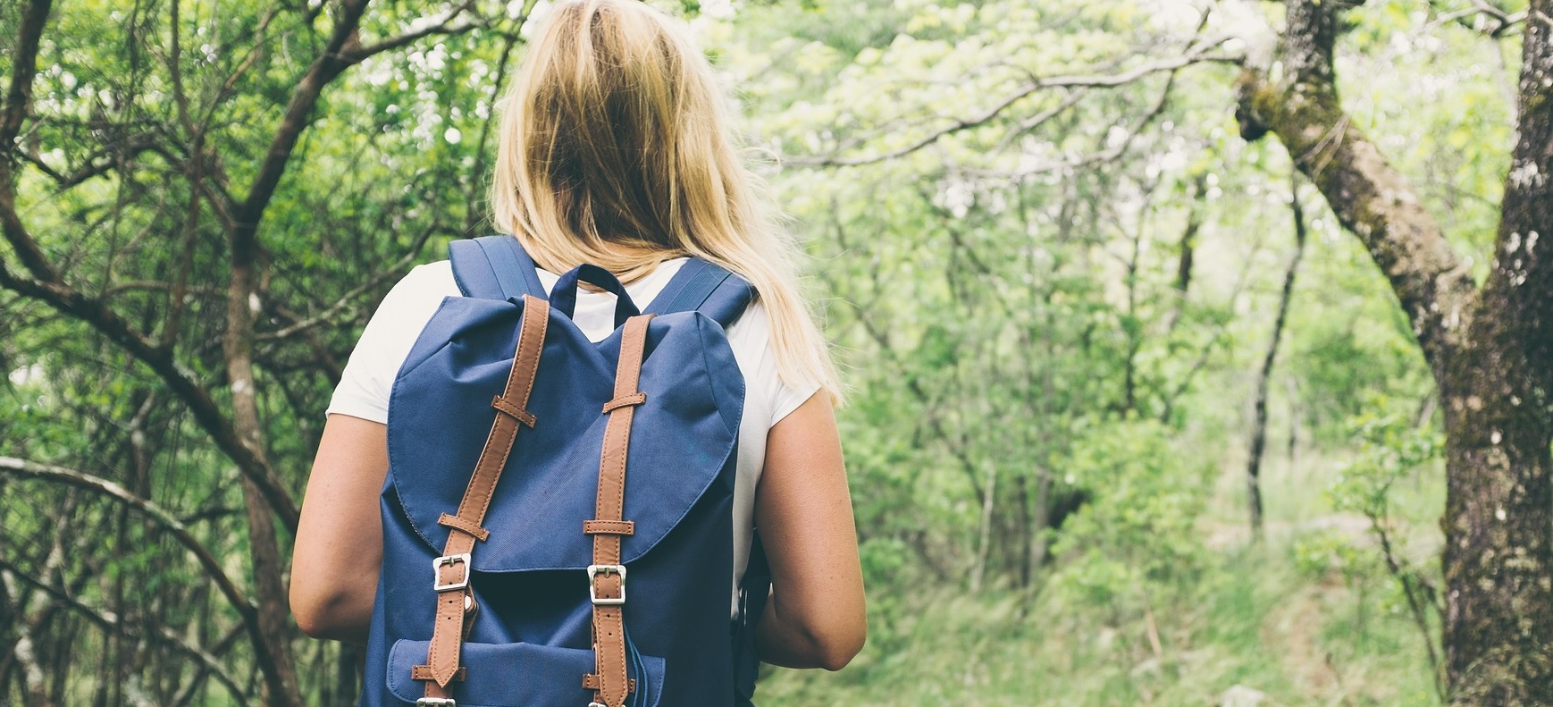 young woman experiences a forest therapy walk at Kortright Centre for Conservation