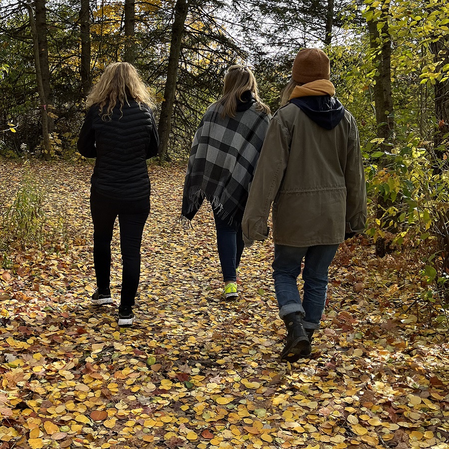 hikers explore a trail at the Kortright Centre for Conservation