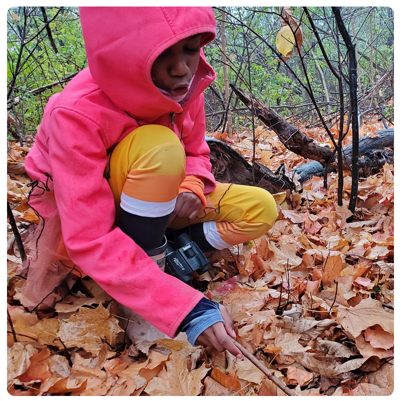 young student enjoys outdoor adventure during The Nature School program at Kortright Centre for Conservation